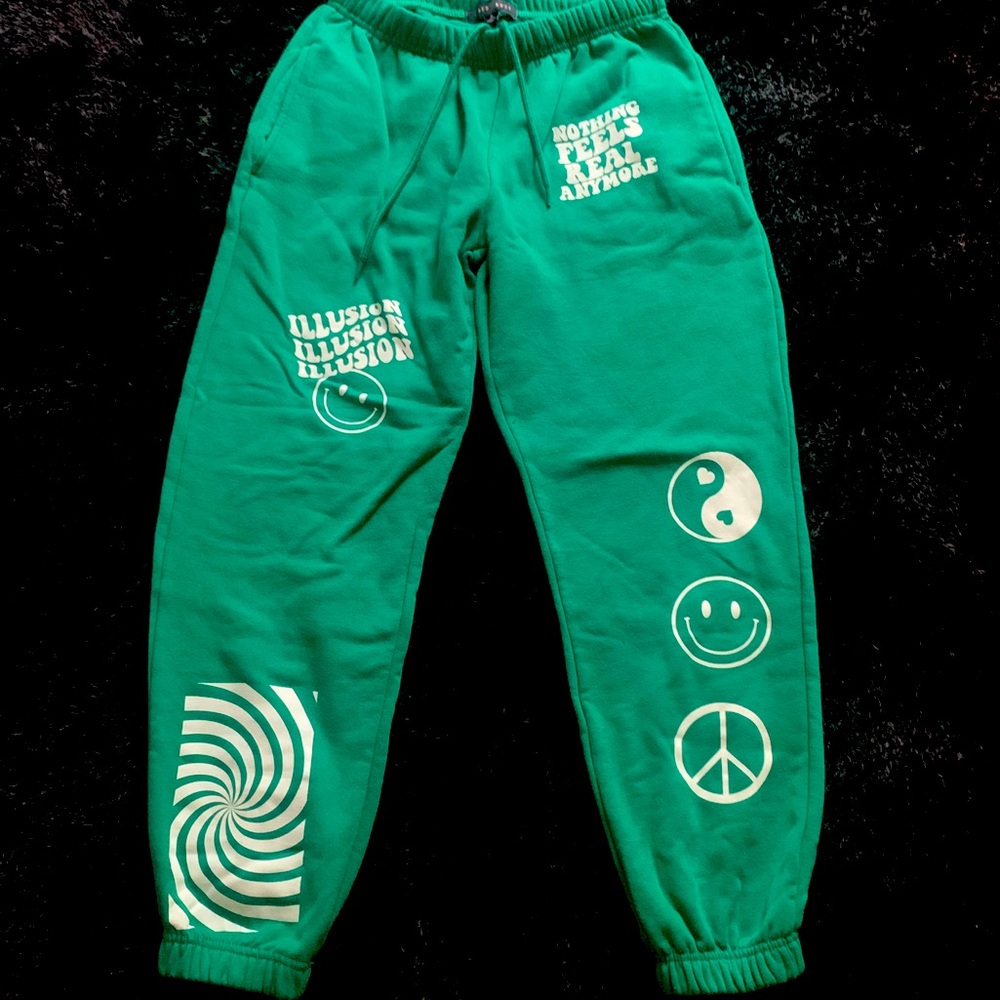 Cute Green sweatpants with cute designs on front.